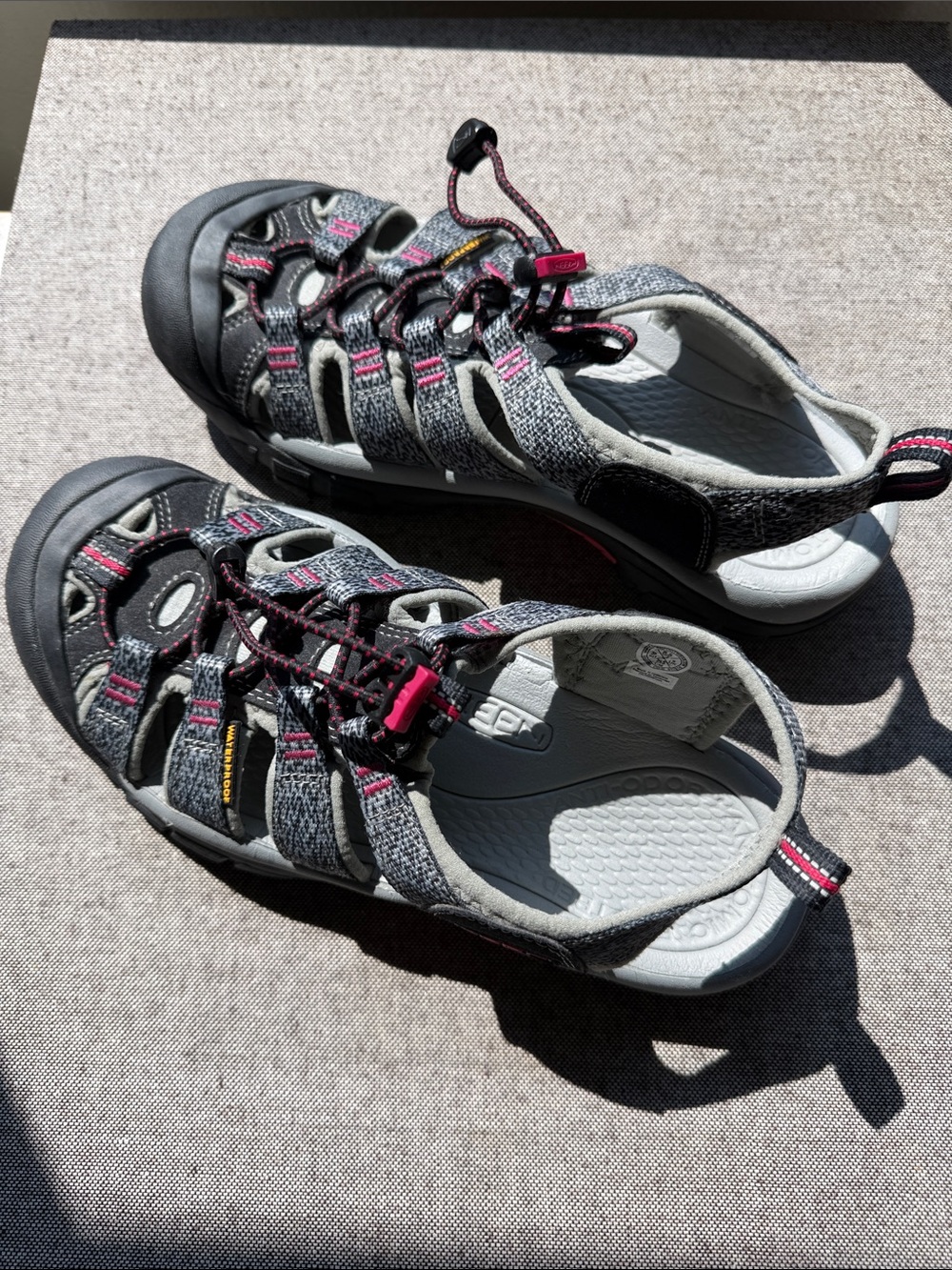 Keen Women’s waterproof Sandals. Gray with pink accents. Rugged soles for hiking